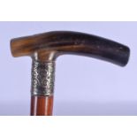 A 19TH CENTURY CONTINENTAL CARVED RHINOCEROS HORN HANDLED WALKING CANE. 88 cm long.