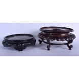 A 19TH CENTURY CHINESE CARVED HONGMU HEAVY HARDWOOD STAND together with another similar. Largest 19