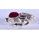 A SILVER RABBIT PIN CUSHION. 11 grams. 4 cm x 2 cm.