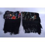 A VINTAGE CHINESE BLACK EMBROIDERED SILK PIANO SHAWL together with another smaller. Largest 145 cm s