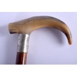 A 19TH CENTURY CONTINENTAL CARVED BUFFALO HORN WALKING CANE with silver mounts. 88 cm long.