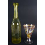 A VINTAGE YELLOW GLASS ENGRAVED DECANTER together with an early silver mounted European glass goblet