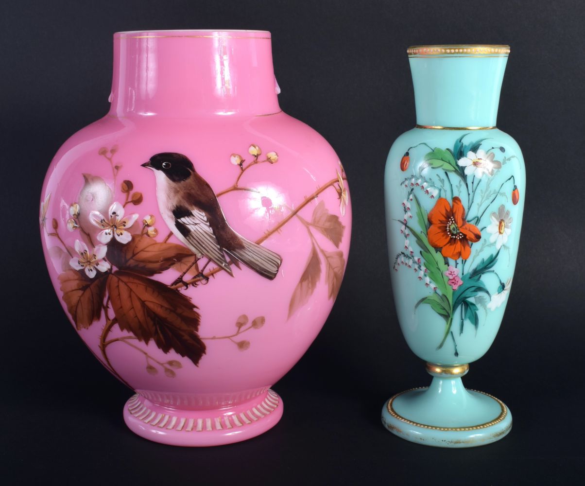 AN EDWARDIAN PINK OPALINE GLASS VASE together with a smaller vase. Largest 21 cm high. (2)