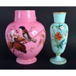 AN EDWARDIAN PINK OPALINE GLASS VASE together with a smaller vase. Largest 21 cm high. (2)