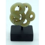 A Chinese Jade plaque on a stand decorated with a snake 5cm. (2).