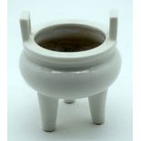 A Chinese Blanc de Chine tripod legged porcelain censer 11 x 9 cm.