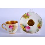 Royal Worcester coffee cup and saucer painted with roses date mark 1927. Cup 5cm high and Saucer 9.