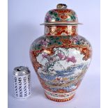 A 19TH CENTURY JAPANESE MEIJI PERIOD IMARI VASE AND COVER painted with figures in various pursuits.