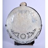 A 19TH CENTURY CONTINENTAL CARVED MOTHER OF PEARL OPENWORK SHELL depicting the baby Jesus. 15 cm x 1