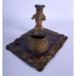 A CONTEMPORARY COLD PAINTED BRONZE FIGURE OF A PUG DOG modelled beside a sack upon a carpet. 19 cm x