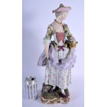 A RARE LARGE 19TH CENTURY MEISSEN PORCELAIN FIGURE OF A STANDING FEMALE modelled holding a floral wr