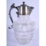 AN ANTIQUE SILVER PLATED CRYSTAL GLASS CLARET JUG. 24 cm x 15 cm.