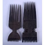 TWO EARLY 20TH CENTURY CARVED TRIBAL PRONGED COMBS. 18 cm x 6 cm. (2)