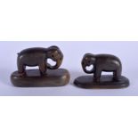 A RARE PAIR OF 19TH CENTURY MIDDLE EASTERN CARVED RHINOCEROS HORN ELEPHANTS modelled upon oval bases