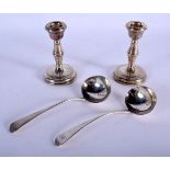 A MATCHED PAIR OF 18TH/19TH CENTURY SILVER LADLES together with a pair of silver candlesticks. Ladle