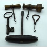 A group of vintage corkscrews, keys etc . (5).