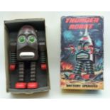 A vintage boxed tin plate Thunder robot battery operated collectable model 28cm.