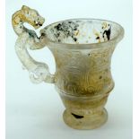 A Chinese glass Libation cup with a Dragon handle 11cm.