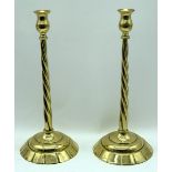 A pair of brass candlesticks . 43cm (2).
