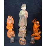 A collection of Chinese and Tibetan wooden figures largest 57cm .