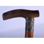 A 19TH CENTURY CONTINENTAL CARVED RHINOCEROS HORN HANDLED WALKING CANE. 88 cm long.