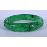 A CHINESE SPINACH JADE BANGLE 20th Century. 7 cm diameter.