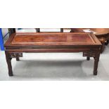 A 19TH CENTURY CHINESE CARVED HARDWOOD RECTANGULAR LOW TABLE of plain form. 46 cm x 122 cm.