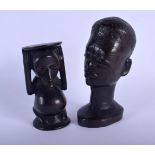 AN EARLY 20TH CENTURY AFRICAN CARVED WOOD TRIBAL SCARIFIED HEAD together with another. Largest 18 cm