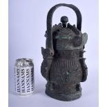 A CHINESE SWING HANDLED BRONZE VASE AND COVER 20th Century, decorated with archaic mask heads and mo