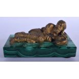 A RARE 19TH CENTURY RUSSIAN GILT BRONZE FIGURE OF A RECLINING MALE modelled upon a malachite base. 1