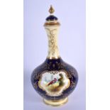 Late 19th/early 20th c. Coalport vase and cover painted with a bird in landscape in a gilt panel on