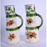 Royal Worcester pair of unusually small size claret jugs painted and gilded with flowers, the mouldi