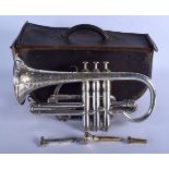 A BOXED BOOSEY & CO TRUMPET decorated with foliage. 33 cm wide.