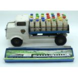 A Vintage Triang milk cart together with a Dinky Silver Jubilee Train set 36cm (2).