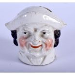 AN ANTIQUE STAFFORDSHIRE PORTRAIT MONEY BOX. 7 cm x 6 cm.