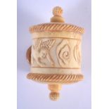 A CHINESE CARVED BONE TAPE MEASURE 20th Century. 4 cm x 3 cm.