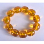 AN AMBER STYLE BRACELET. 8 cm wide.