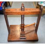 AN ANTIQUE BOOK PRESS. 77 cm x 67 cm x 46 cm.