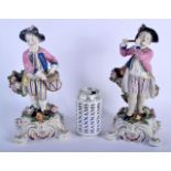 A LARGE PAIR OF 19TH CENTURY CONTINENTAL PORCELAIN FIGURES modelled upon purple painted rococo bases