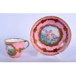 A MID 19TH CENTURY FRENCH SEVRES PORCELAIN CUP AND SAUCER painted with classical scenes upon a pink