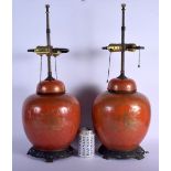 A PAIR OF 19TH CENTURY CHINESE PORCELAIN CORAL GROUND GINGER JARS AND COVERS Qing, converted to lamp