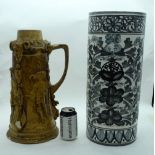 A porcelain stick stand together with an American stone ware decorative stein 47 20cm (2).