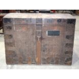 A large wooden metal banded chest 63 x 83 x 55cm.