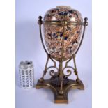 AN UNUSUAL 19TH CENTURY EUROPEAN IMARI TYPE PORCELAIN EGG FORM VASE upon a brass mounted base. 35 cm