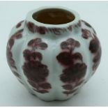 A small Chinese vase decorated with Foliage in relief 8 x 10cm.