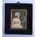 AN ANTIQUE CONTINENTAL PAINTED IVORY PORTRAIT MINIATURE painted with a female within a landscape. Im