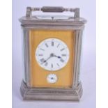 AN ANTIQUE SILVERED BRASS REPEATING CARRIAGE CLOCK. 18 cm high inc handle.