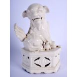 A 19TH CENTURY CHINESE BLANC DE CHINE PORCELAIN FIGURE OF A BUDDHISTIC LION Qing. 20 cm x 12 cm.