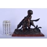 A 19TH CENTURY FRENCH BRONZE FIGURE OF A ROAMING BOY modelled pulling back a hunting hound. 21 cm x