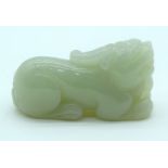 A Chinese jade paperweight in the form of a Lion. 7cm .